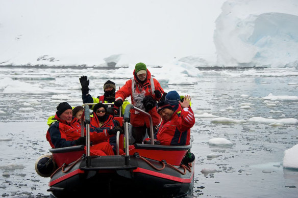 Zodiacs carry passengers for their first experience on Antarctic ice.