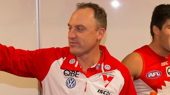 Happy as larry: Swans coach John Longmire wants to move on from Dane Rampe's post-siren decision to climb the goal post.