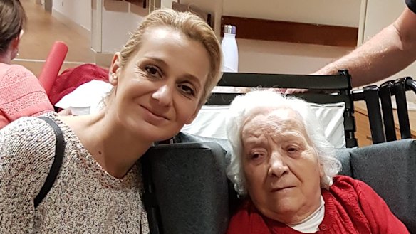 Concetta Onorato (right) with a family member at the Assisi aged care facility. 