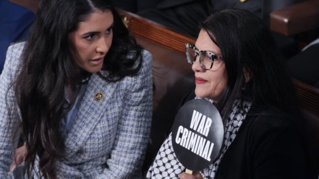 Democrat Congress member Rashida Tlaib held a sign in the chamber that says "war criminal" as Netanyahu spoke.