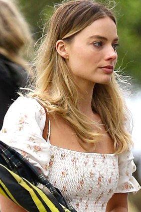 Margot Robbie in a white summer dress at her grandmother's burial.