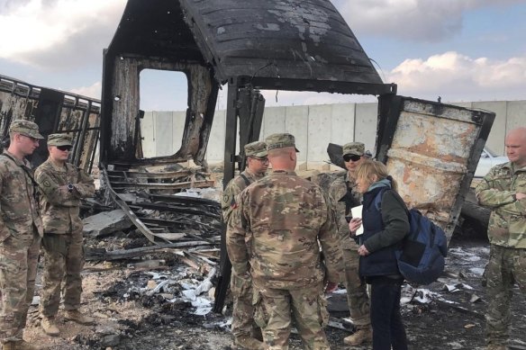 US forces survey the damage from a barrage of Iranian rockets on the Ain Asad airbase in Anbar, Iraq.