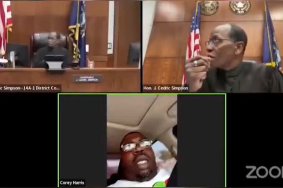 The scene from the court showing Corey Harris, bottom, driving while participating in a pre-trial court hearing earlier this month.