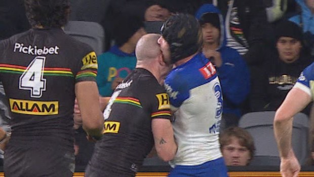 Matt Burton clashes heads with Penrith’s Liam Martin.