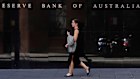 A woman walks past the Reserve Bank of Australia in Sydney. Last week Australia's central bank cut its benchmark interest rate by a quarter of a percentage point to a record low 0.25%, urgently seeking to alleviate economic shocks from the new coronavirus.