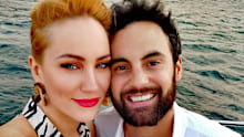 Jules Robinson and Cam Merchant on a boat.