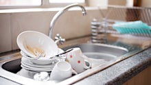 Shot of kitchen sink full of dirty dishes
