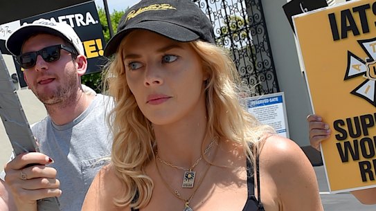 Actor Samara Weaving carries a sign on a picket line outside Paramount studios in Los Angeles on Monday.