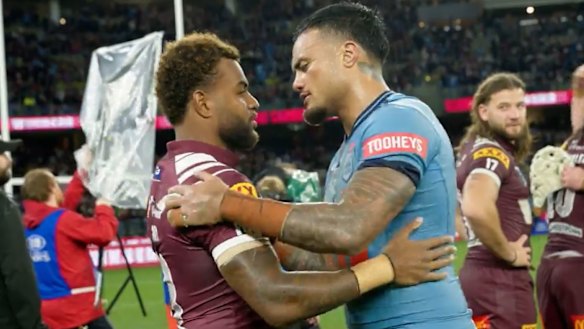 Spencer Leniu and Ezra Mam embrace after Wednesday’s Origin match in Perth.