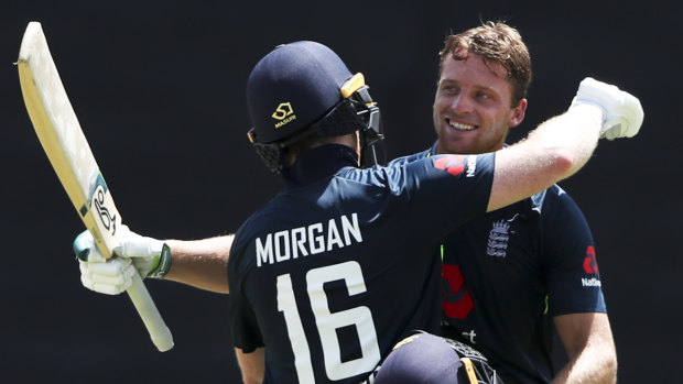 Jos Buttler is congratulated by Eoin Morgan  after scoring a ton in the high-scoring ODI.