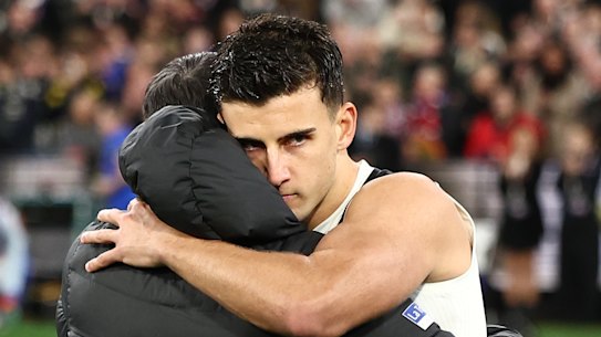 Collingwood coach Craig McRae and stand-in captain Nick Daicos embrace after their side was eliminated from this year’s finals series.