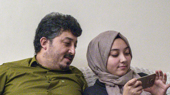 Ablet Abdugani with his daughter Serife, 15, right, and his sons Abdussalam, 11, and Abdullah, five, at home in Istanbul.