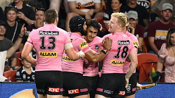 Penrith celebrate a Casey McLean try.