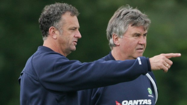 Mastermind: Former Socceroos coach Guus Hiddink, right, with then assistant Graham Arnold in 2006. Arnold is now in his second stint as Socceroos coach.