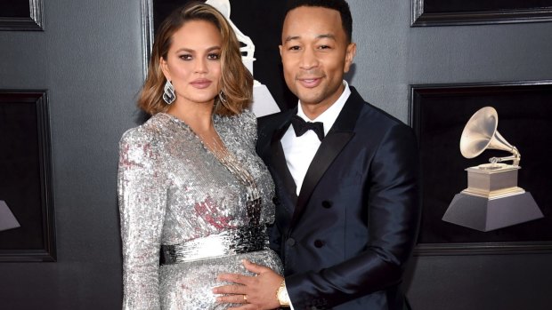 A pregnant Chrissy Teigen, left, with husband John Legend at the 60th annual Grammy Awards, in New York in January.