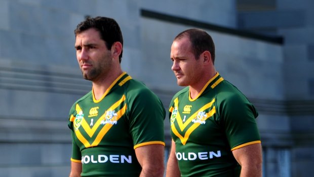 Cameron Smith (left) and Matt Scott representing the Kangaroos back in 2013.