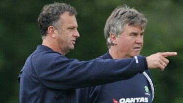 Mastermind: Former Socceroos coach Guus Hiddink, right, with then assistant Graham Arnold in 2006. Arnold is now in his second stint as Socceroos coach.