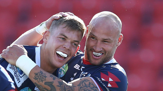Tom Pincus of the Rebels celebrates with Bill Meakes after scoring a try on Saturday. 