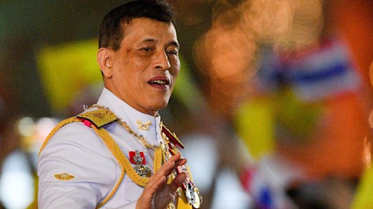 Thailand’s King Maha Vajiralongkorn waves to royalist supporters during a ceremony in 2020.