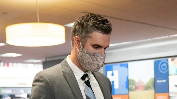 Former police officer Thomas Lane walks through security as he arrived for a hearing at the Hennepin County Government Centre in Minneapolis.