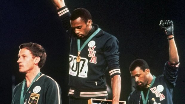 Tommie Smith (centre) and John Carlos (right) and Australian Peter Norman at the 1968 Olympics.