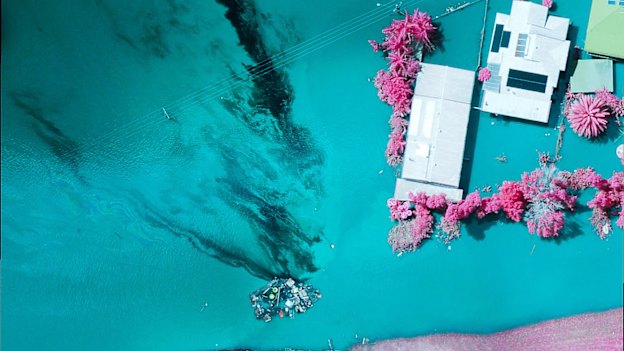 An aerial infrared image taken of a pile of rubbish in Lismore and a stream of contamination behind it.