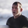 Tony Abbott, surfing in 2014.
