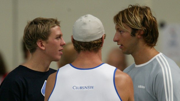 Craig Stevens, Simon Cowley (back turned) and Ian Thorpe share a conversation.
