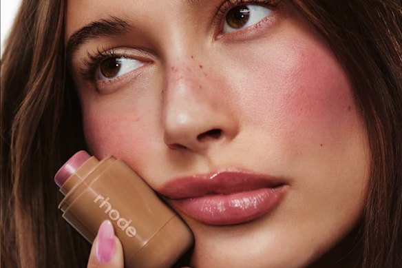 The “Strawberry girl” trend of   applying blusher.