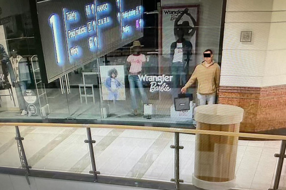 The man posed in a shop window before allegedly stealing the jewellery, food and clothing.