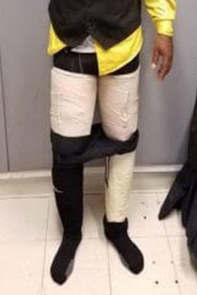 A Fly Jamaica Airways crew member with cocaine strapped to his legs.