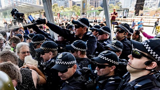 Protesters and police clash outside a mining conference in 2019. 