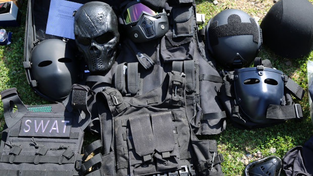 Face masks, SWAT vests and armoured helmets were also found.