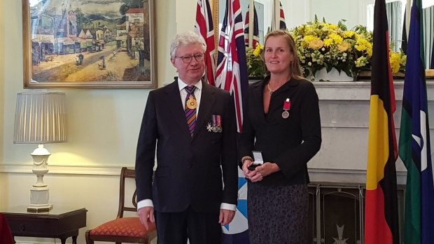 Elizabeth Adams was awarded the Bravery Medal and Group Bravery Citation by the Governor Paul de Jersey AC for pulling a woman from a burning car. 