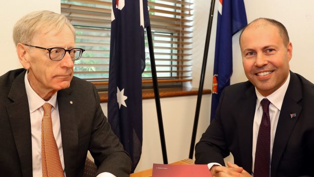 Commissioner Kenneth Hayne delivers his report to Treasurer Josh Frydenberg.