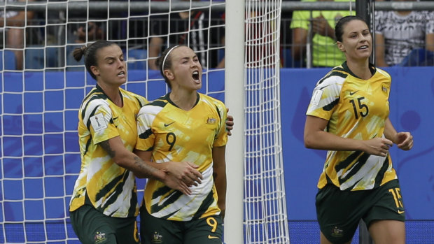Good times: Caitlin Foord (centre) scoring against Brazil.