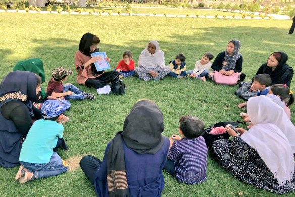 Women and children at the Chihilsitoon Garden in Kabul.