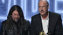 David Grohl, from left, Krist Novoselic, and Pat Smear of Nirvana accept the video vanguard award during the MTV Video Music Awards.