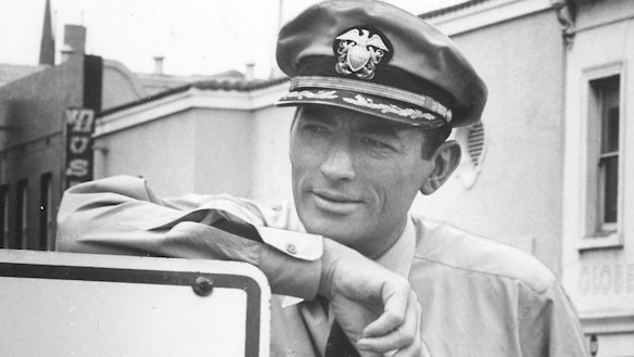 Gregory Peck relaxes  during the shoot in Lonsdale Street, Melbourne.