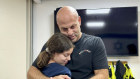 In this photo provided by the Israeli Army, Hila Rotem Shoshani, a released hostage, reunites with her uncle Sunday.