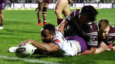 Storm's Justin Olam scores one of his three tries against the Sea Eagles.