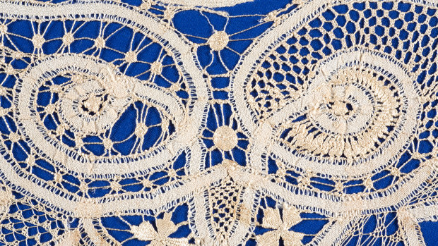 Fine lacework on a blue background.