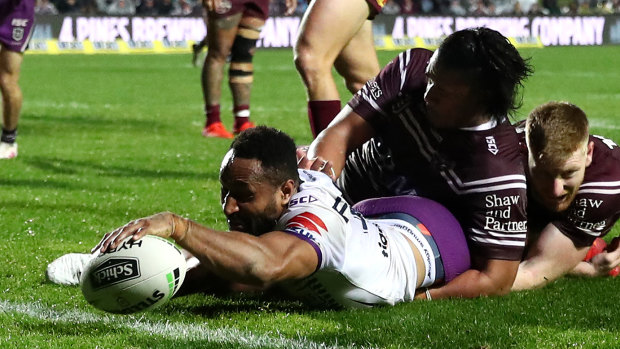 Storm's Justin Olam scores one of his three tries against the Sea Eagles.