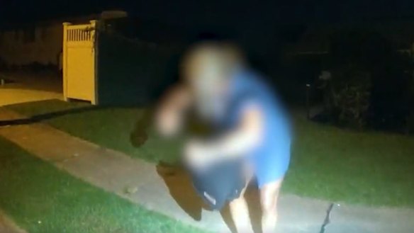 Police take a person into custody after the armed robberies at the Gold Coast.