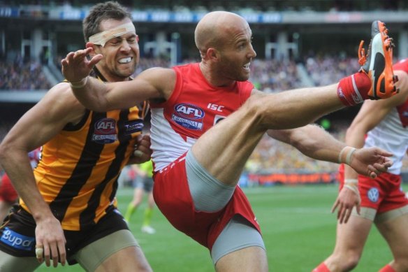 Action from the 2012 AFL Grand Final between Hawthorn and Sydney.