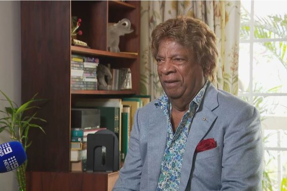 Kamahl has been charged with stalking and intimidating behaviour towards a woman.