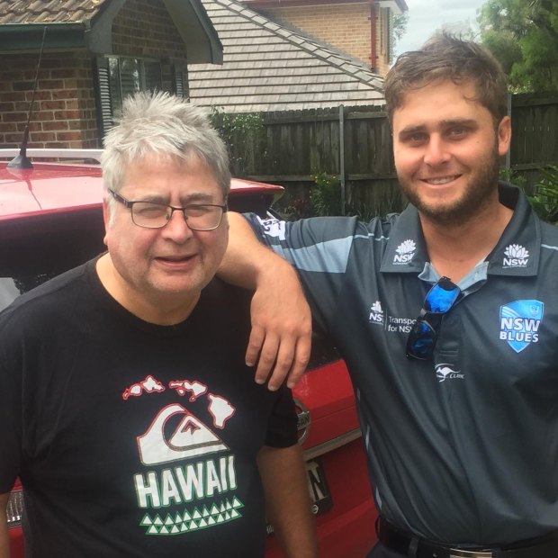Nick Bertus and his dad, Nigel, outside the family home. 