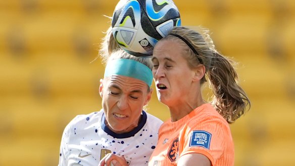 United States’ Julie Ertz, left, and Netherlands’ Katja Snoeijs jump for a header.