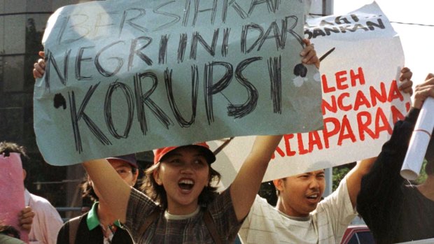 Old problem: Students hold up posters reading “Clean the country of corruption” during an anti-government protest in Jakarta in 1977.