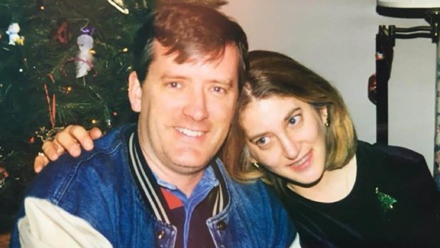 A family photo of Andrea Chamblee and her late husband, John McNamara, at Christmas time circa 1997.